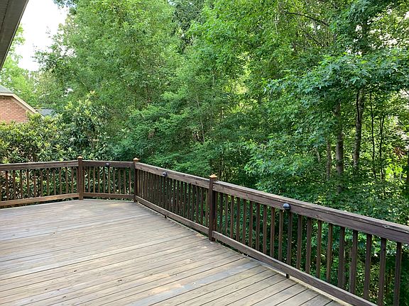 Deck overlooking fenced yard