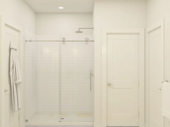 Primary bath with glass shower enclosure