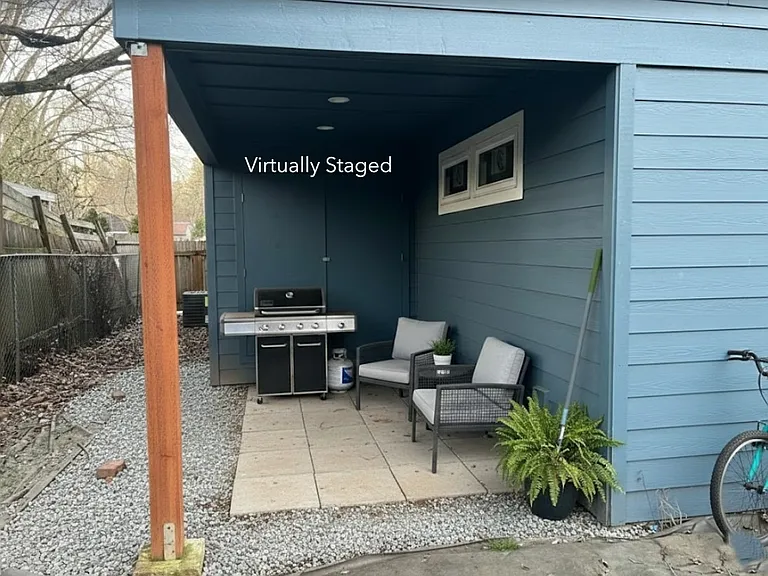Backyard covered Storage area with grill chairs