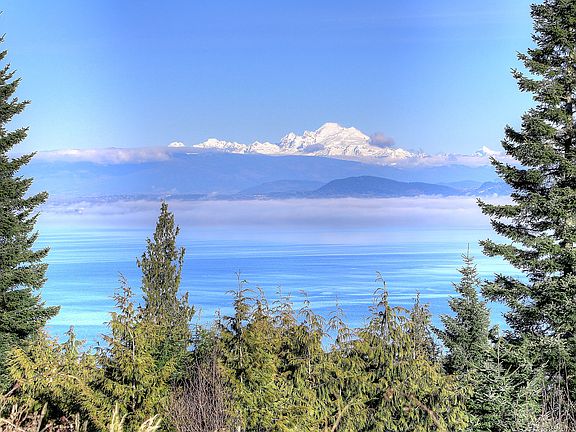 Even on a cloudy day the views from this lot span across Utsalady to Snowcapped Mt Baker.