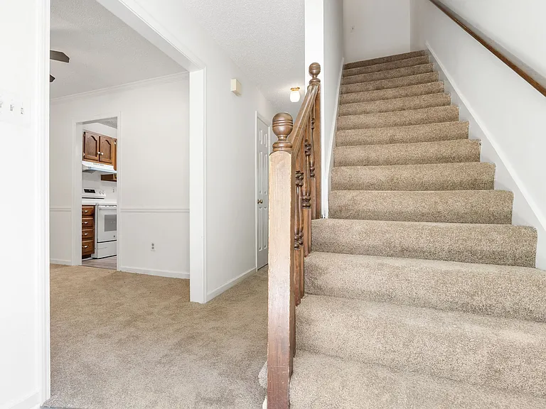 Open floor plan with seamless flow between the entry, kitchen, and living areas