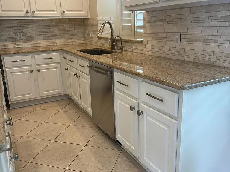 Instant hot water dispenser, under cabinet lighting.