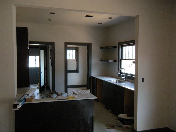 Kitchen with granite counter tops and custom made cabinets
