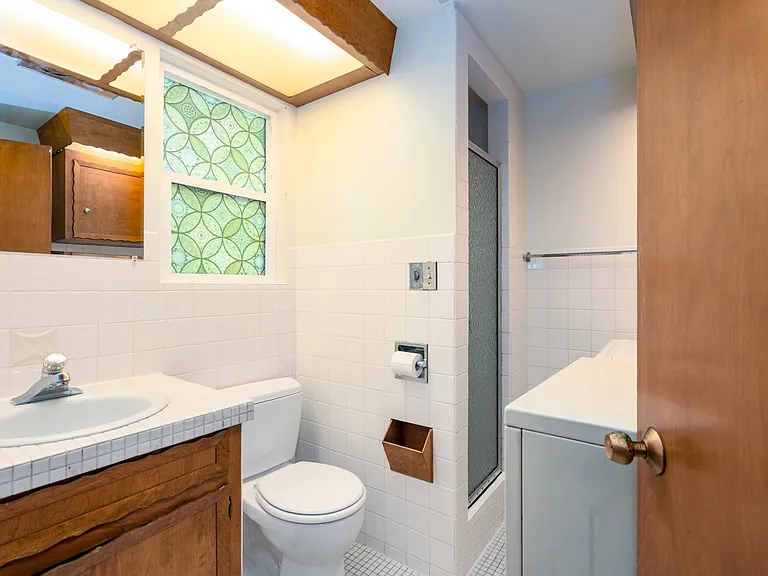 powder room with shower and laundry