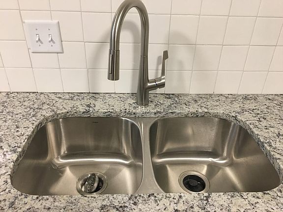 German made pull out faucet and under mounted SS sink