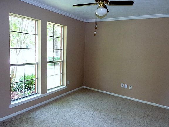 Formal Dining with crown molding, fresh carpet and paint.