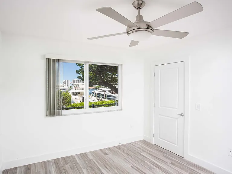 Master bedroom features great views and wood flooring throughout