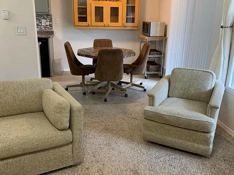 Proximity of living room and dining area. Sliding door to patio.