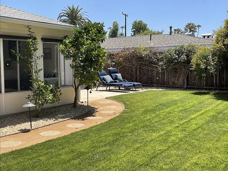 Backyard with Lawn and Lounge Chairs