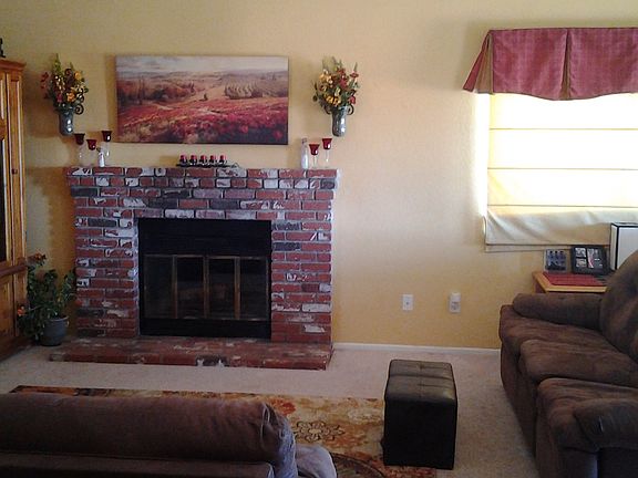 Living room with fireplace and vaulted ceilings