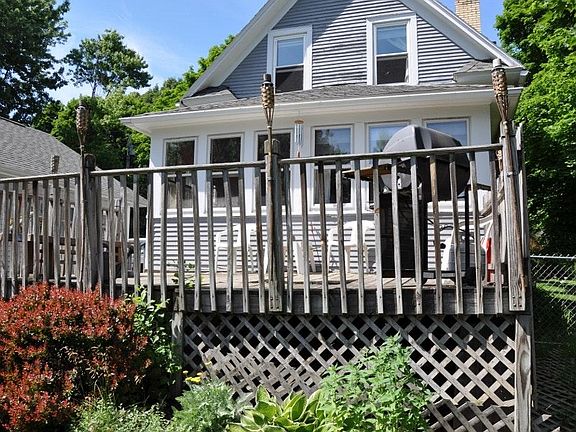 Rear of house shows deck and garden