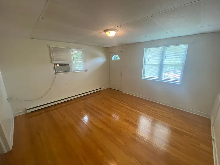 Private carport, in-unit laundry, and the Lakewood strip right outside your door. — Photo 14
