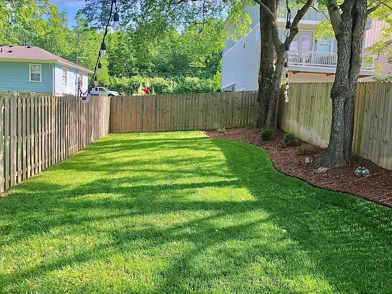 Great sized backyard with outdoor string lights and fenced in backyard!