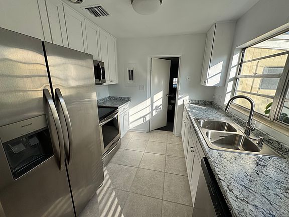 Kitchen, upgraded with NEW 42 inch cabinets and stainless steel appliances