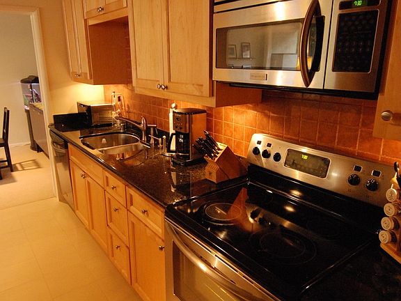 Kitchen-Granite Counters, Custom Cabinetry & Light, Stainless Steel Appliances