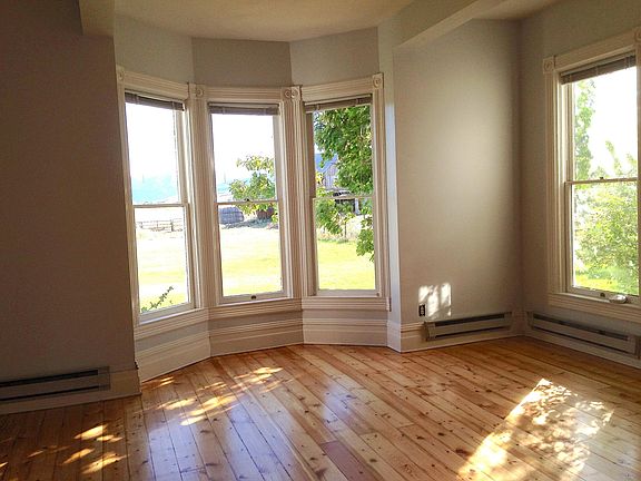 Living room bay windows looking toward the Spanish Peaks. 