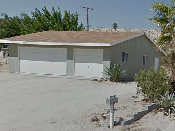 Detached garage immediately to the left of the house
