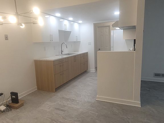 View from entry through dining space to kitchen.