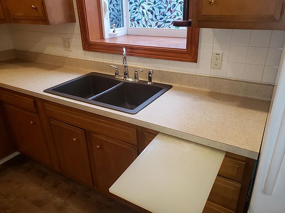 Kitchen includes "Over-The-Range" Microwave, oven, refrigerator with icemaker, & dishwasher. Also includes two bay windows, solid surface wink, and LED lighting. Also includes vinyl plank flooring, tile backsplash, & crown molding.
