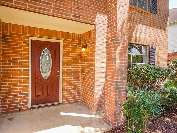 Enjoy Your Covered Entryway with A Lovely Door with Glass Panel and Brand New Exterior Light Fixtures!