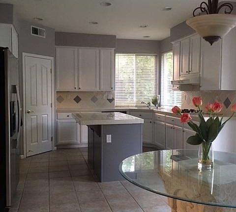 Kitchen with new stainless steel appliances.