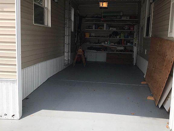 1 car garage with shelves and garage opener