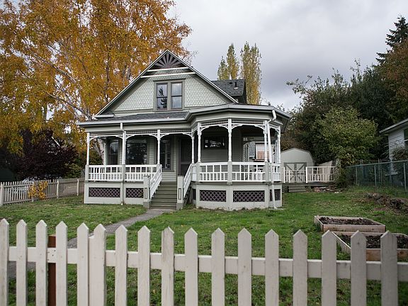 Front of the house with wrap around porch.