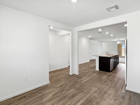 Formal dining room located off of the entry with access to the kitchen.