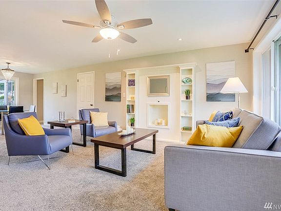 Enjoy this built-in wall unit, new ceiling fan and brand new carpets.