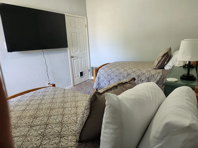 2 Twin Beds, dresser, large TV for gaming or movies, closet