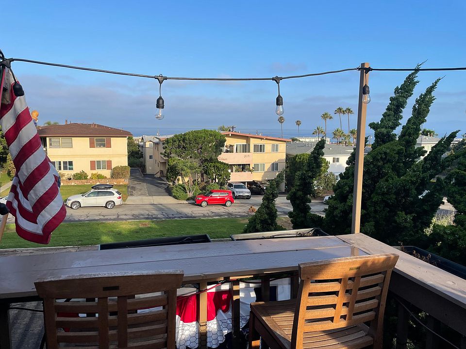 Outdoor patio off porch with ocean views and party lights