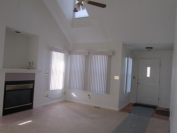 Living room with skylights and fireplace