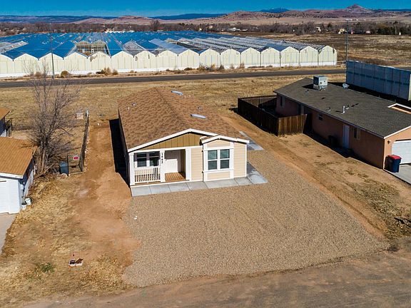 Long life shingles, skylights, nice covered deck, 2x6 construction, upgraded insulation, Low-E vinyl windows.  Ground set with concrete block foundation.