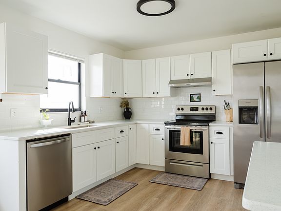 Remodeled kitchen in 2023 with new stainless steel appliances. Also includes a microwave.