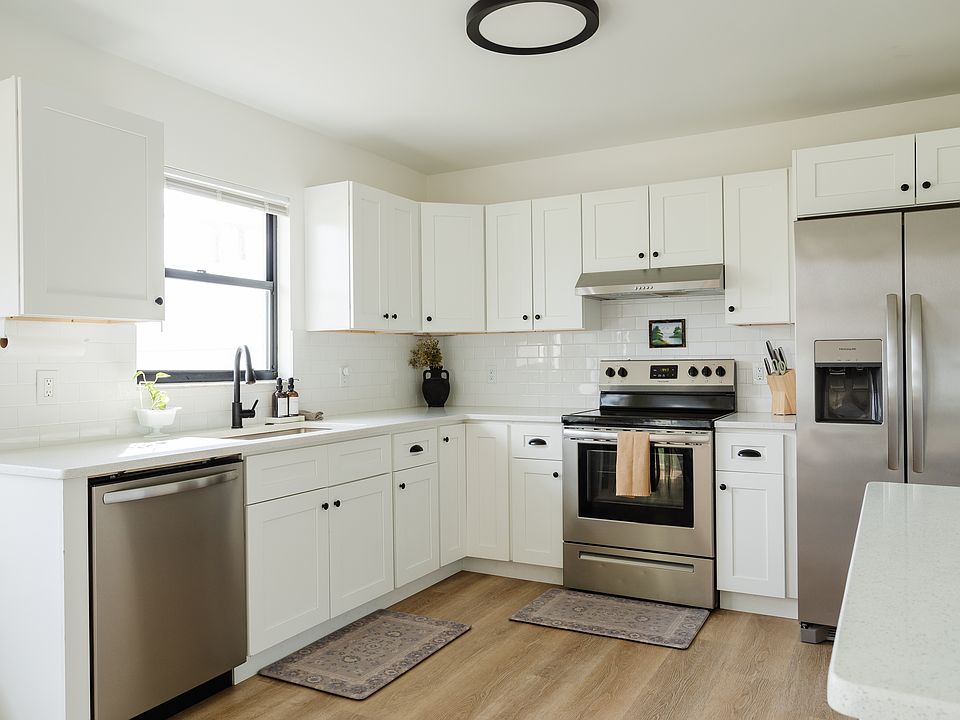 Remodeled kitchen in 2023 with new stainless steel appliances. Also includes a microwave.