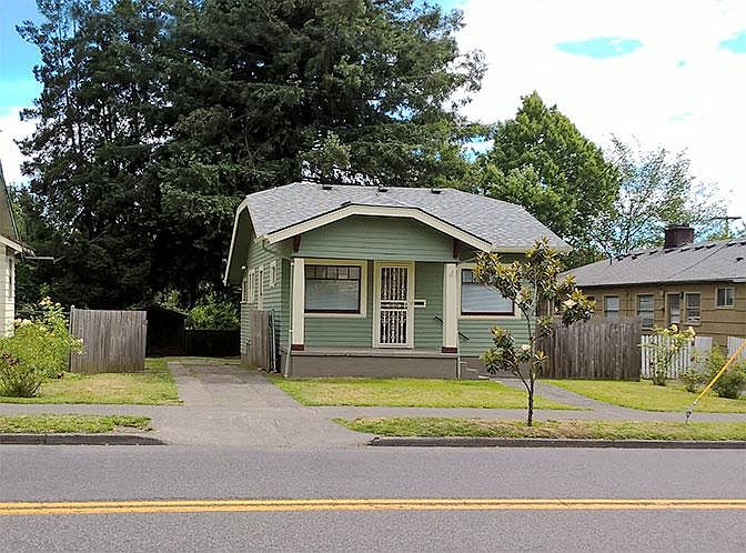 Front view with locked gate open