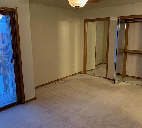 Master Bedroom. This picture shows a deck but this unit just has large windows, no deck.