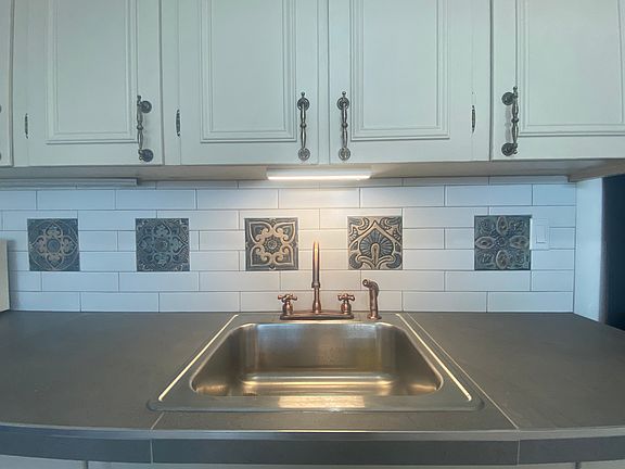 New backsplash, sink and copper look faucet with spray hose