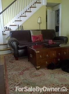 Formal Living Room
						:
						Formal living room with fireplace with gas logs. 1/2 bath is off of this room.