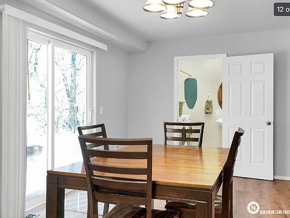 Dining with view of half bath/laundry
