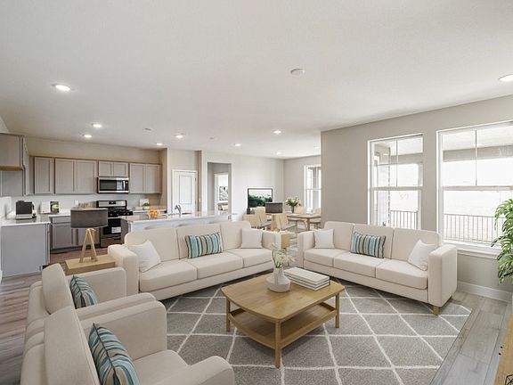 The Brownstone features an open floor plan that seamlessly connects the gathering room, kitchen, and