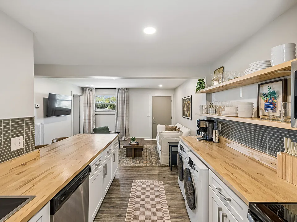 Open floor plan from the kitchen to living room. The kichen is equipped with all the essentials you would need, along with seating at the island high top.