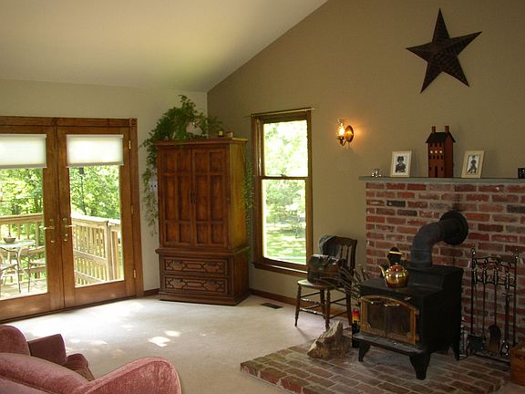 Formal living room with door to upper deck