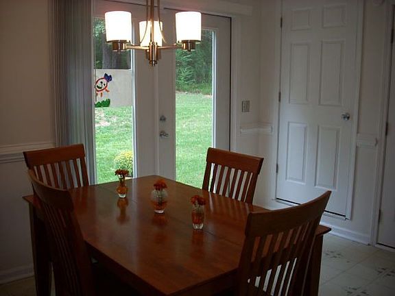 Dining area with fresh paint and French doors.