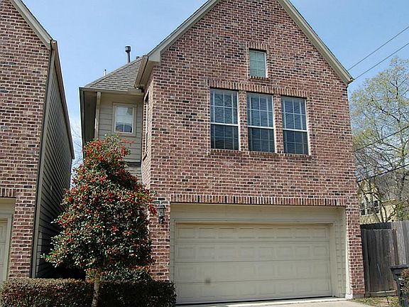 Another view of front of house. Two car garage.
