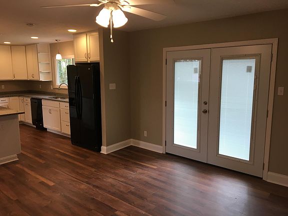 Looking from hallway into dining room and kitchen.