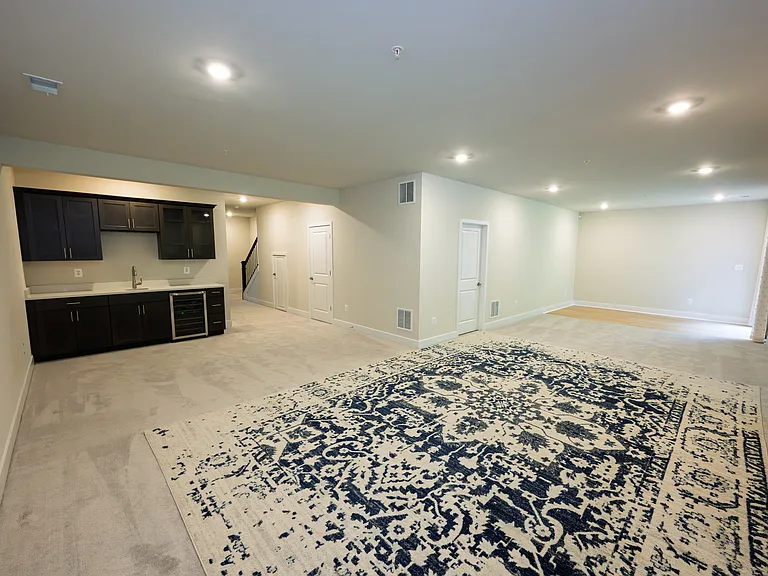 Finished Walk-Out Lower Level with 9' Ceilings, Wet Bar, and Entertainment Area