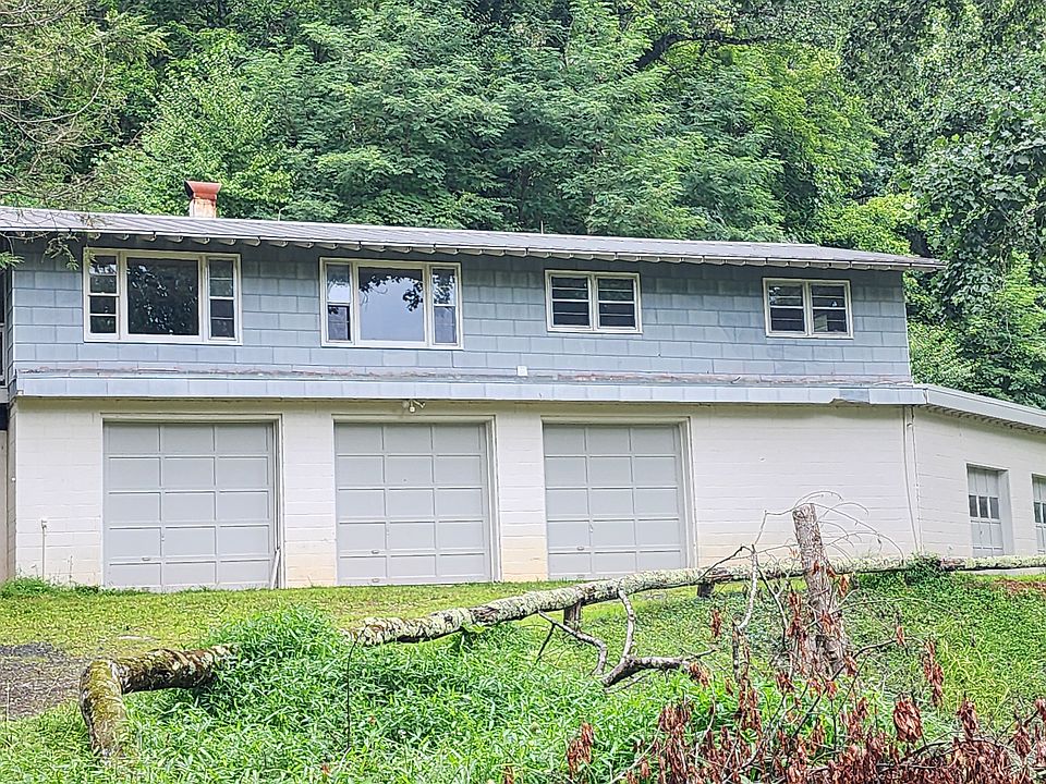Front plus peek view of covered deck (home is all one level)
