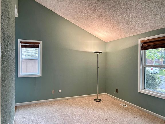 Master bedroom, vaulted ceilings, four windows