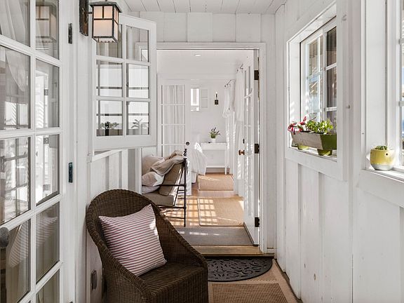 Sitting breezeway to front door.
